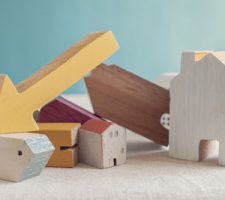 Wooden Block House Price Crash Concept