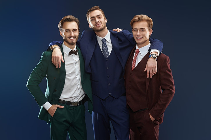 men in suits hugging